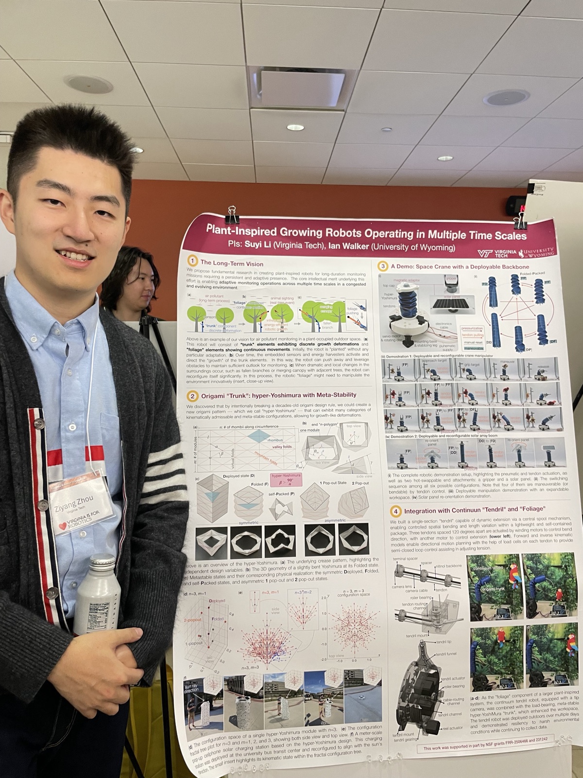 Ziyang Zhou standing beside his plant-inspired growing robots research poster